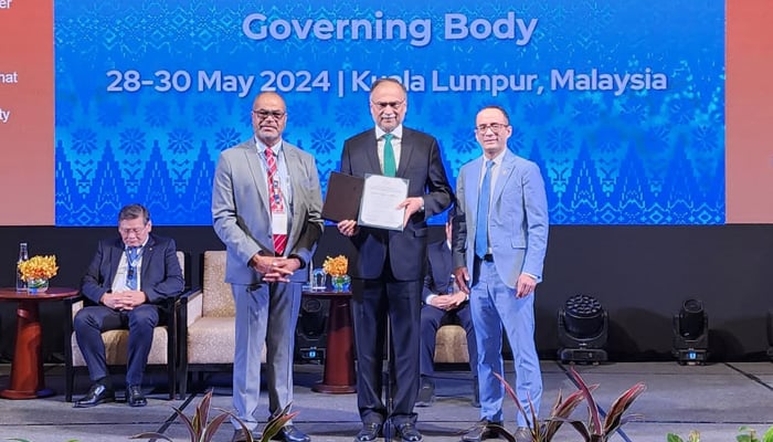 Planning Minister Ahsan Iqbal (centre) receives APO Meritorious and Distinguished Award 2024. — Supplied
