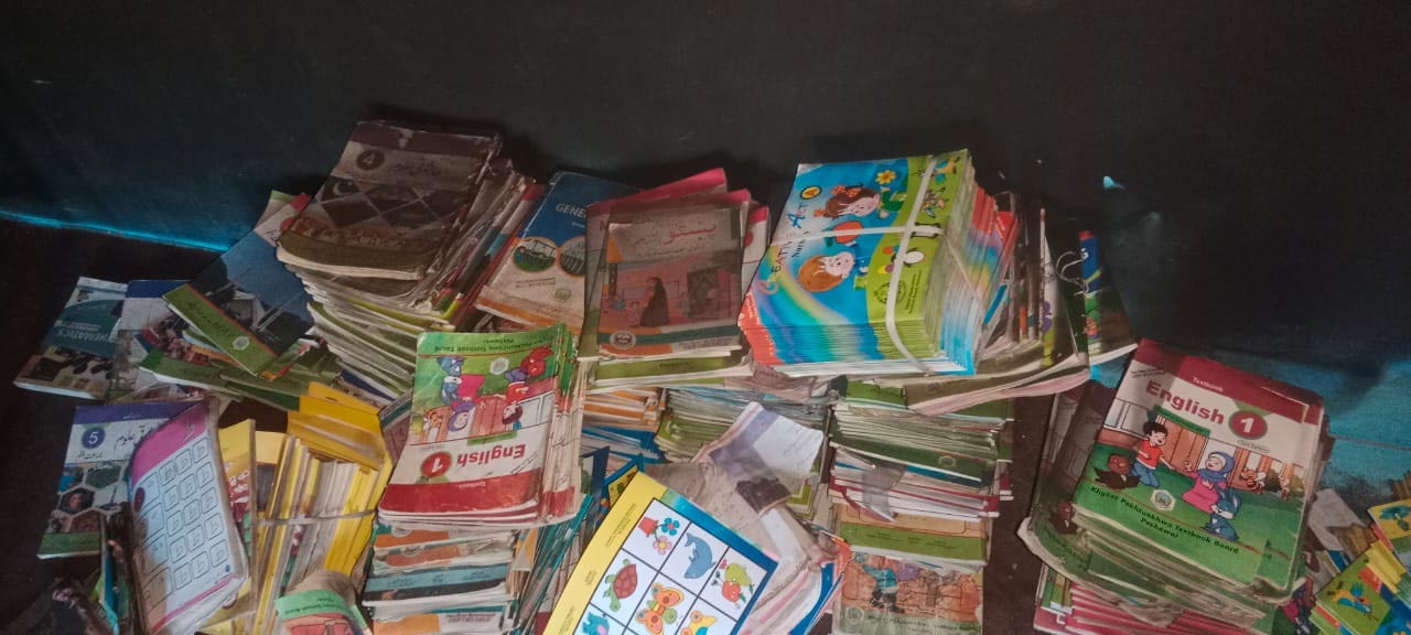School books can be seen scattered after arsonists damage school in North Waziristan. — Reporter