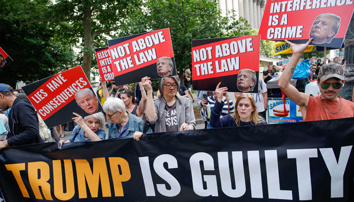 People react after former US President and Republican presidential candidate Donald Trump was convicted in his criminal trial outside of Manhattan Criminal Court in New York City, on May 30, 2024. —AFP