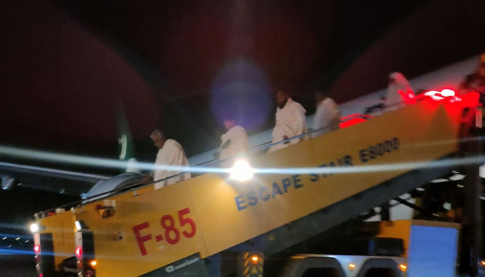 Passengers of the PIA Hajj flight, PK 839 are being offloaded after the aircraft made an emergency landing at the Riyadh airport on May 31, 2024. — Photo by reporter