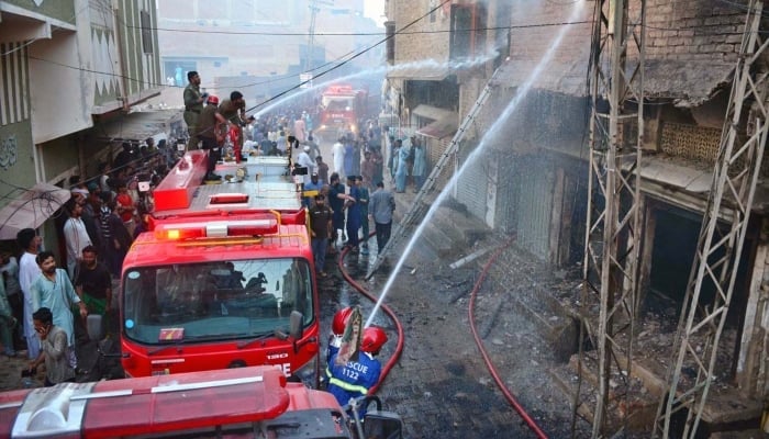 Firefighters struggling to extinguish fire that erupted in LPG gas shop after cylinder explosion at Preetabad area in Hyderabad on May 30, 2024. —APP