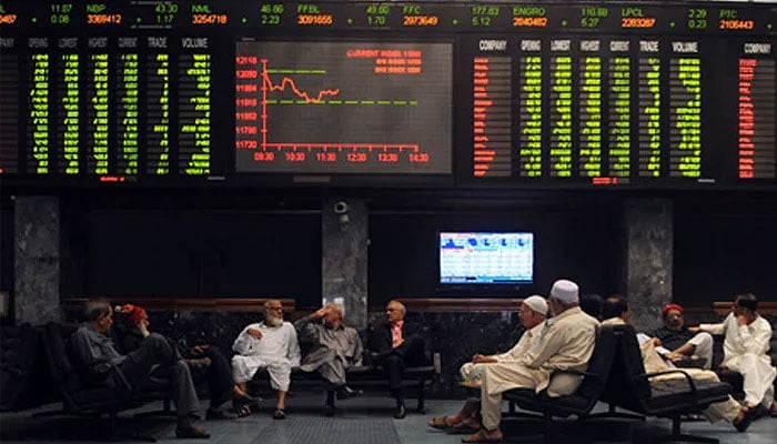Investors are sitting in the hall of Pakistan Stock Exchange in Karachi. — AFP