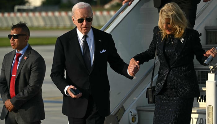 US President Joe Biden and First Lady Jill Biden disembark Air Force One upon arrival at Orly airport outside Paris, on June 6, 2024. — AFP