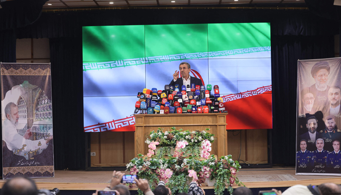 Former Iranian president Mahmoud Ahmadinejad addresses the media after registering his candidacy for Irans upcoming presidential election in Tehran on June 2, 2024. — AFP