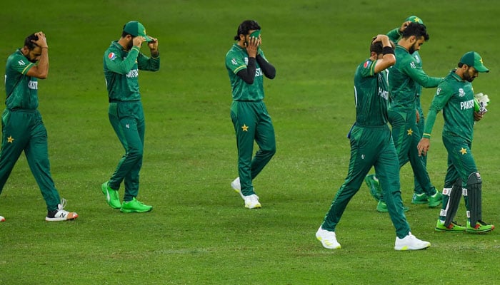 Pakistans cricketers leave the field at the end of the ICC men’s Twenty20 World Cup semi-final match against Australia at the Dubai International Cricket Stadium. — AFP File