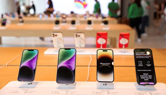 Apple iPhones are seen inside an Apple retail store. —Reuters