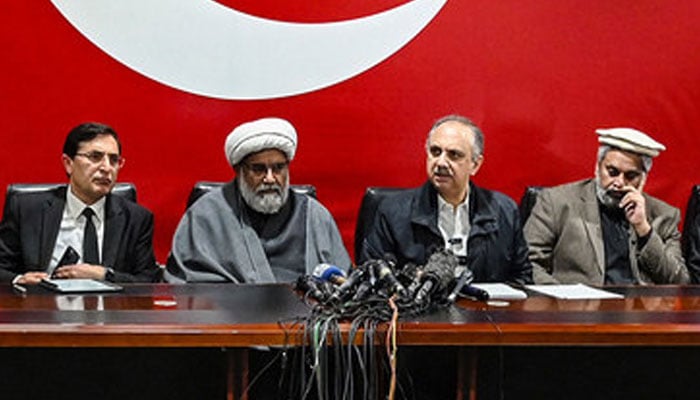 PTI Chairman Barrister Gohar (first left) and NA Opposition Leader Omar Ayub pictured alongside Sunni Ittehad Council Chief Sahibzada Muhammad Hamid Raza (first left) attend a press conference following their coalition in Islamabad on February 19, 2024. — AFP