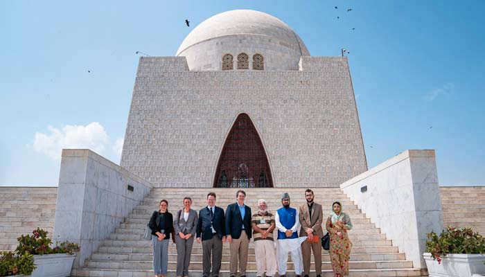 US envoy Andrew Schofer and other officials pictured in front of Mazar-e-Quaid in Karachi. — Supplied