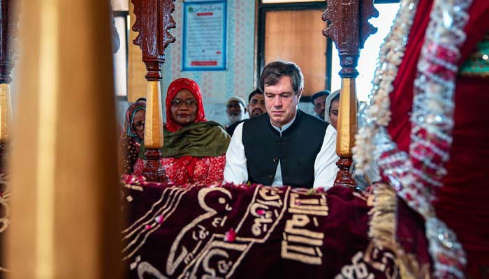 US envoy Andrew Schofer pictured at shrine of Sufi saint Manghopir. — Supplied