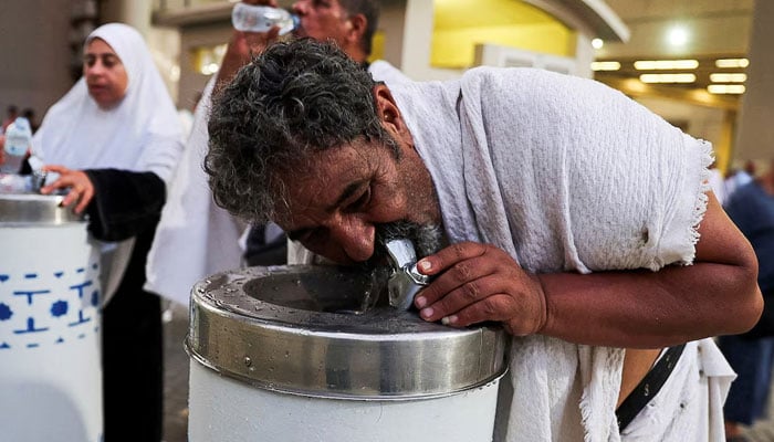 Muslim pilgrims drink water during extremely hot weather during the annual Hajj pilgrimage, in Mina, Saudi Arabia, June 16, 2024. — Reuters