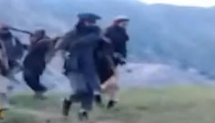 Members of the TTP seen wandering in a mountainous region in this file footage. — YouTube/Geo News Live