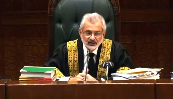 Chief Justice of Pakistan Qazi Faez Isa presides the televised full court hearing on September 18, 2023, in this still taken from a video. — State media