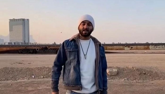 Iranian rapper Toomaj Salehi can be seen performing in this still from a music video. — YouTube/Toomaj Salehi