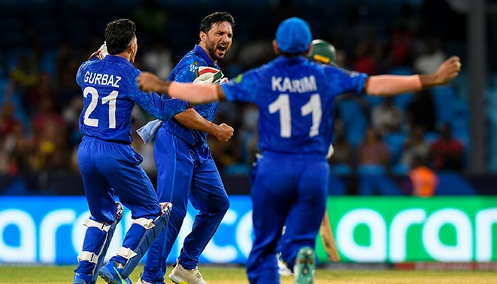 Afghanistans Gulbadin Naib (C) celebrates with teammates after the dismissal of Australias Tim David during T20 World Cup match between Afghanistan and Australia at Arnos Vale Stadium in Arnos Vale, Saint Vincent and the Grenadines on June 22, 2024. — AFP