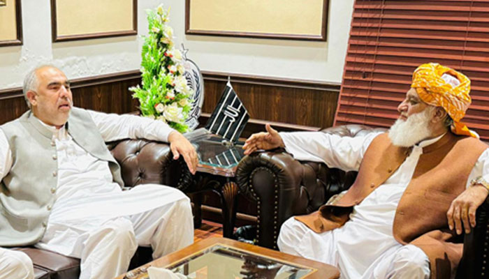 Pakistan Tehreek-e-Insaf leader Asaq Qasier (left) meets Jamiat Ulema-e-Islam-Fazl (JUI-F) Chief Maulana Fazlur Rehman in Islamabad on June 22, 2024. — Reporter