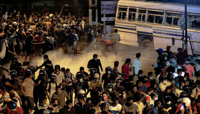 Demonstrators move away from tear gas used by the police near Sri Lankan President Gotabaya Rajapaksas residence during a protest against him as many parts of the crisis-hit country faced up to 13 hours without electricity due to a shortage of foreign currency to import fuel, in Colombo, Sri Lanka March 31, 2022. — Reuters