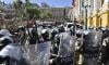 Tanks surround Bolivian govt buildings as president urges democracy