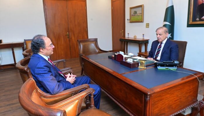 Finance Minister Muhammad Aurangzeb (left) calls on Prime Minister Shehbaz Sharif after budget approval in the National Assembly. — APP
