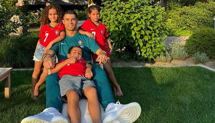 Portuguese player Cristiano Ronaldo spends quality time with his kids as his son sits on his lap while his daughters stand alongside him. — Instagram/@cristiano