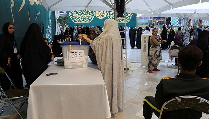 An Iranian woman votes at a polling station in a snap presidential election to choose a successor to Ebrahim Raisi following his death in a helicopter crash, in Tehran, Iran June 28, 2024. — Reuters