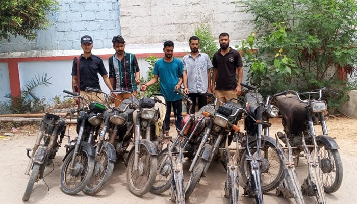 Members of the motorcycle theft gang are seen in police custody along with the recovered stolen motorcycles and chassis. — Reporter