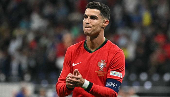 Portugals forward Cristiano Ronaldo applauds the fans at the end of the UEFA Euro 2024 round of 16 football match against Slovenia at the Frankfurt Arena in Frankfurt am Main, Germany on July 1, 2024. — AFP