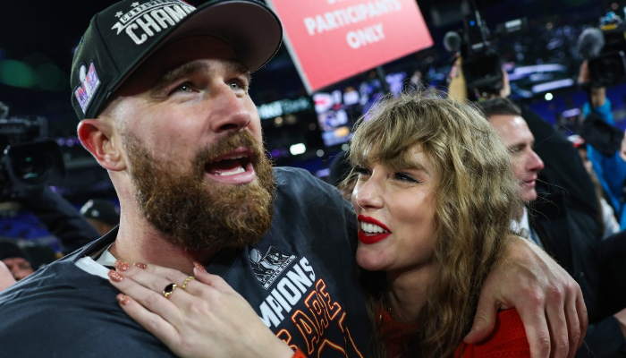 Travis Kelce kisses Taylor Swift on head