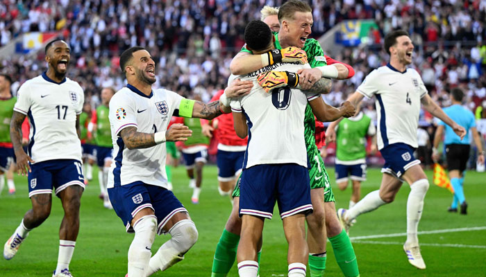 England’s forward #17 Ivan Toney, defender #02 Kyle Walker, defender #08 Trent Alexander-Arnold, goalkeeper #01 Jordan Pickford and midfielder #04 Declan Rice celebrate after winning the UEFA Euro 2024 quarter-final football match between England and Switzerland at the Duesseldorf Arena in Duesseldorf on July 6, 2024. — AFP