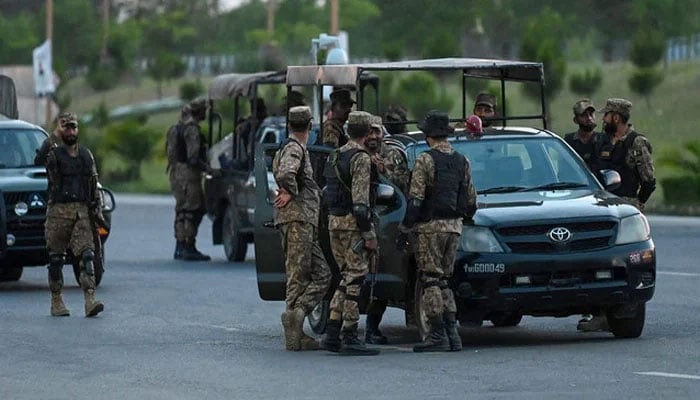 Army troops stand guard in the red zone in Islamabad on May 11, 2023. — AFP