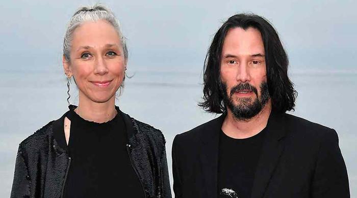 Keanu Reeves makes rare appearance with Alexandra Grant at MotoGP