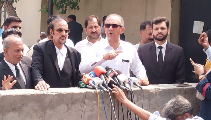 Leader of Opposition in National Assembly Omar Ayub (centre) speaking to media in Islamabad on July 9, 2024. —Facebook/ OmarAyubKhan.Official