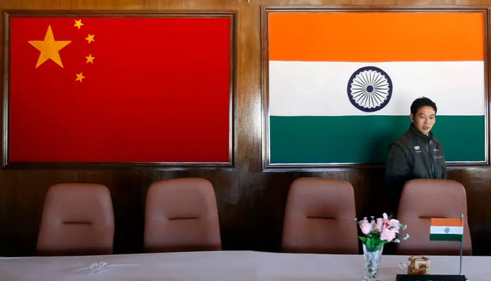 A man walks inside a conference room used for meetings between military commanders of China and India, at the Indian side of the Indo-China border at Bumla, in the northeastern Indian state of Arunachal Pradesh, November 11, 2009. — Reuters