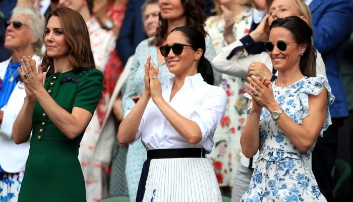 Meghan had been placed in between Kate and her sister Pippa