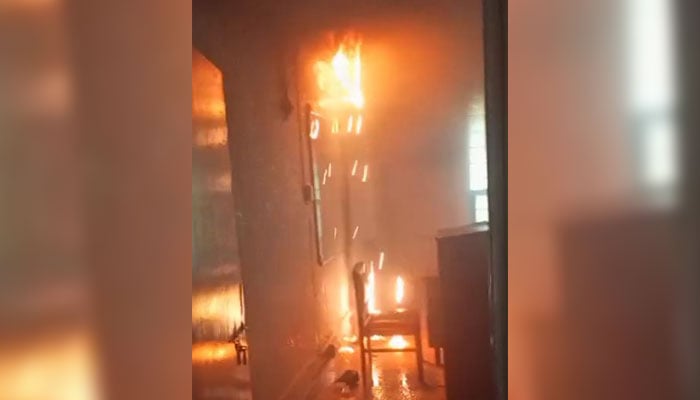 Flames can be seen in the Karachi Universitys Mass Communication department in a blaze that erupted on July 15, 2024. — Screeengrab/Geo.tv