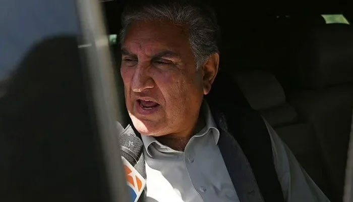 PTIs Shah Mahmood Qureshi speaks with the media in Islamabad on May 10, 2023. — AFP