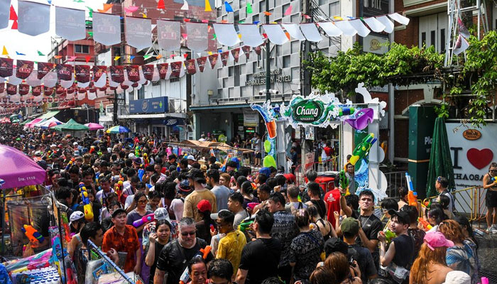 Locals and tourists play with water as they celebrate the Songkran holiday which marks the Thai New Year in Bangkok, Thailand, April 13, 2023. — Reuters