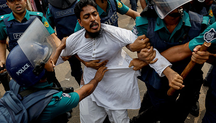 Bangladesh police detain a man a day after the clash between Bangladesh Chhatra League, the student wing of the ruling party Bangladesh Awami League, and anti-quota protesters, in Dhaka, Bangladesh, July 17, 2024. — Reuters