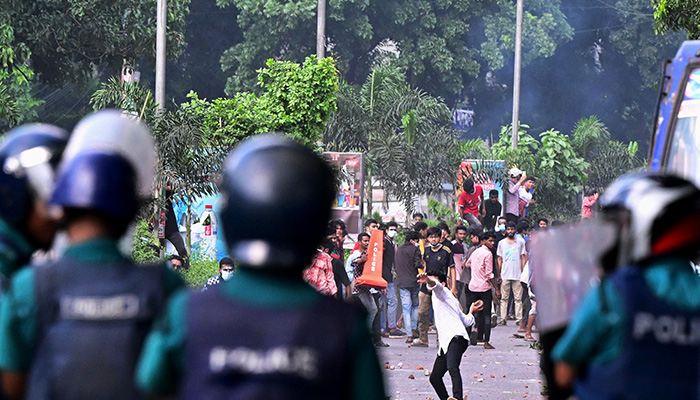 Students clash with the police during ongoing anti-quota protest in Dhaka on July 18, 2024. — AFP