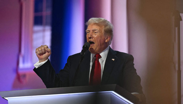 US former President and 2024 Republican presidential candidate Donald Trump raises a fist as he speaks during the last day of the 2024 Republican National Convention at the Fiserv Forum in Milwaukee, Wisconsin, on July 18, 2024. — AFP