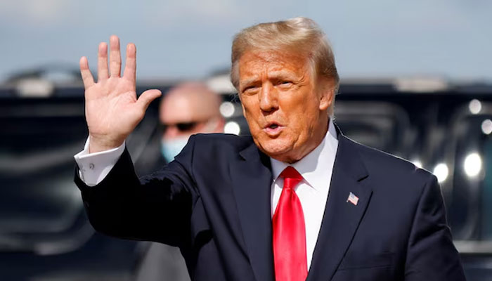 Former US president Donald Trump waves as he arrives at Palm Beach International Airport in West Palm Beach, Florida, US, January 20, 2021. — Reuters