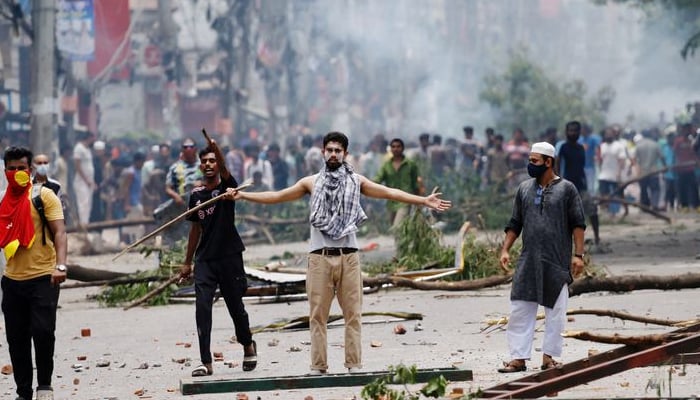 Protesters clash with Border Guard Bangladesh and the state-owned Bangladesh Television on July 19, 2024 in Dhaka Bangladesh — Reuters