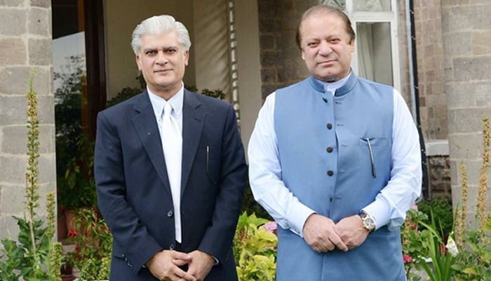 Former PML-N leader Dr Syed Asif Kirmani (left) poses for a picture with PML-N President Nawaz Sharif in this undated photo. — X/@KirmaniAsif