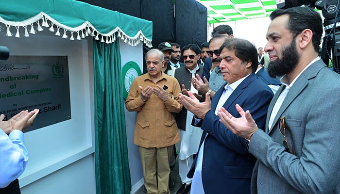 PM Shehbaz Sharif offering dua after unveiling a plaque during the groundbreaking of Jinnah Medical Complex in Islamabad on July 21, 2024. — APP