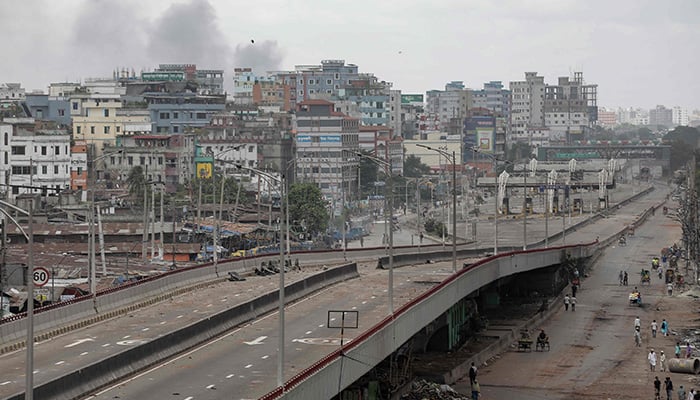 Smoke bellows from the backside of Dhaka´s southern outskirt neighbourhood as clash erupts between police and anti-quota protesters in Dhaka, Bangladesh, July 21, 2024. — AFP