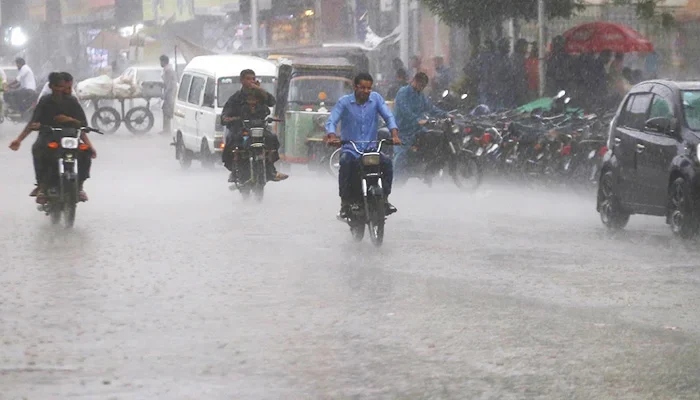 Motorcyclists commuting amid rain in Karachi on September 20, 2023. — INP