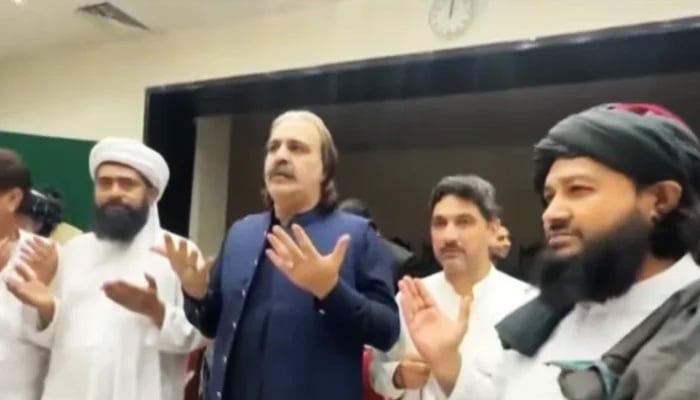 Khyber Pakhtunkhwa Chief Minister Ali Amin Gandapur (centre) with Bannu jirga members in Peshawar, on July 22, 2024. — Screengrab/Geo News