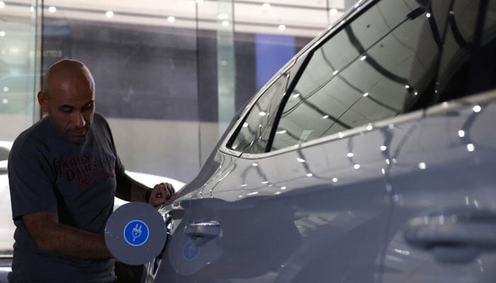 A person fills fuel in a car in Saudi Arabia. — AFP/File