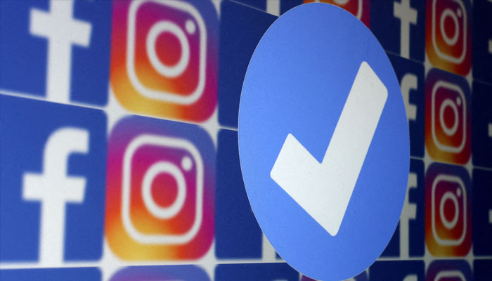 A blue verification badge and the logos of Facebook and Instagram are seen in this picture illustration taken January 19, 2023. — Reuters