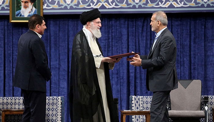 Irans Supreme Leader Ayatollah Ali Khamenei (centre) gives a Presidential decree to countrys president-elect Masoud Pezeshkian (right) during an endorsement ceremony in Tehran, Iran, July 28, 2024. — Reuters