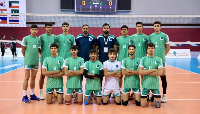 Pakistan volleyball team players and officials pose for a picture during the 15th Asian Men’s U18 Volleyball Championship in Bahrain. — Reporter